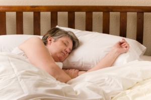Middle-aged woman asleep in bed